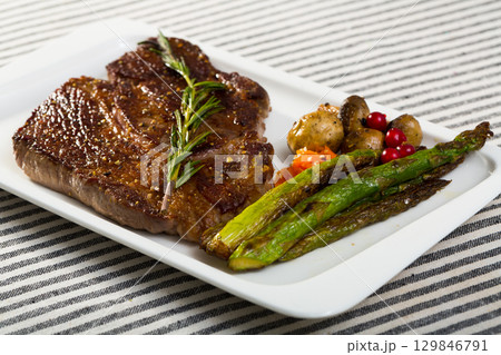 Photography of plate with beef entrecote with mushroom and asparagus Photography of plate with beef entrecote with mushroom and asparagus 129846791