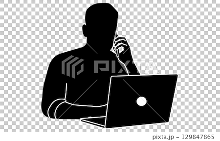 Silhouette of a man working on a laptop and talking on the phone 129847865