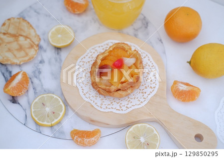 Tropical Fruit Dessert in Soft Pastel Setting 129850295