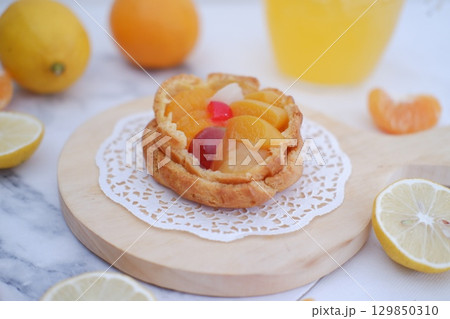 Tropical Fruit Dessert in Soft Pastel Setting 129850310