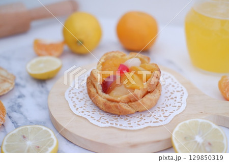 Tropical Fruit Dessert in Soft Pastel Setting 129850319