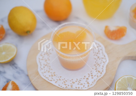 Tropical Fruit Dessert in Soft Pastel Setting 129850350