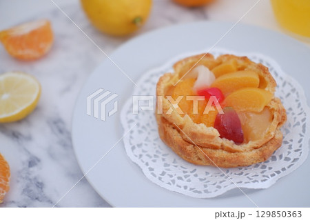 Tropical Fruit Dessert in Soft Pastel Setting 129850363