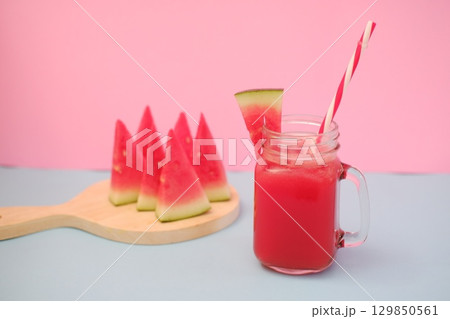 Summer Refreshment Watermelon Drink with Fruit Garnish Summer Refreshment Watermelon Drink with Fruit Garnish 129850561