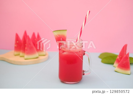 Summer Refreshment Watermelon Drink with Fruit Garnish Summer Refreshment Watermelon Drink with Fruit Garnish 129850572