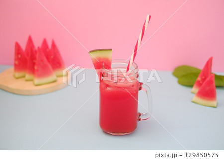 Summer Refreshment Watermelon Drink with Fruit Garnish Summer Refreshment Watermelon Drink with Fruit Garnish 129850575