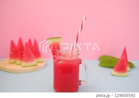 Summer Refreshment Watermelon Drink with Fruit Garnish Summer Refreshment Watermelon Drink with Fruit Garnish 129850592