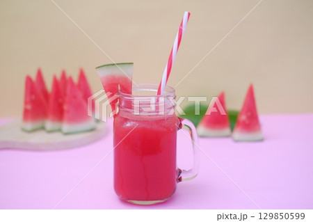 Summer Refreshment Watermelon Drink with Fruit Garnish Summer Refreshment Watermelon Drink with Fruit Garnish 129850599