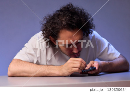 The Innovative Smartphone Cleaning Device is Being Demonstrated During Use and Functionality The Innovative Smartphone Cleaning Device is Being Demonstrated During Use and Functionality 129850684