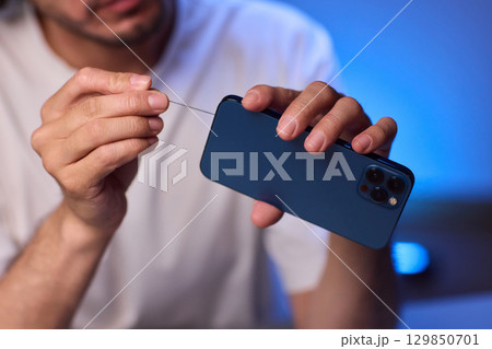 The Innovative Smartphone Cleaning Device is Being Demonstrated During Use and Functionality The Innovative Smartphone Cleaning Device is Being Demonstrated During Use and Functionality 129850701