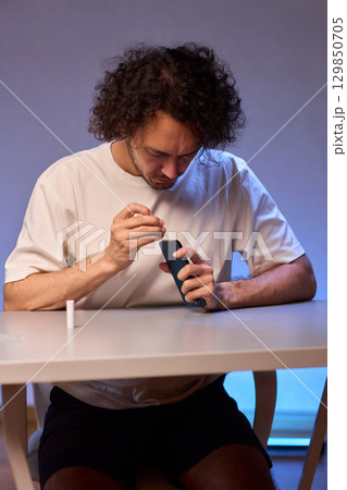 The Innovative Smartphone Cleaning Device is Being Demonstrated During Use and Functionality The Innovative Smartphone Cleaning Device is Being Demonstrated During Use and Functionality 129850705