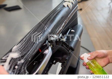 Cleaning with Spray in a Modern Workspace Setup for Enhanced Productivity and Hygiene Cleaning with Spray in a Modern Workspace Setup for Enhanced Productivity and Hygiene 129851122