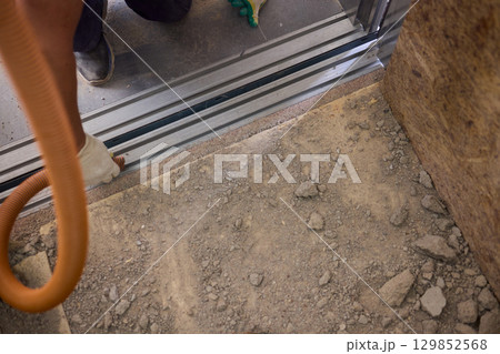 The area designated for construction is filled with dust and contains essential cleaning equipment The area designated for construction is filled with dust and contains essential cleaning equipment 129852568
