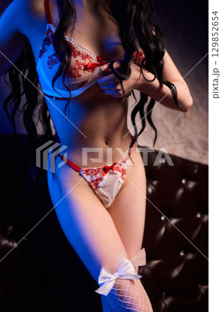 Elegant Seduction A Captivating and Charming Pose in Stylish and Alluring Lingerie Elegant Seduction A Captivating and Charming Pose in Stylish and Alluring Lingerie 129852654
