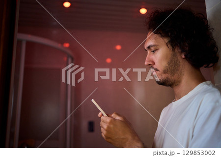 A Colorful Remote Control Set Against the Backdrop of a Dimly Lit Room Environment A Colorful Remote Control Set Against the Backdrop of a Dimly Lit Room Environment 129853002