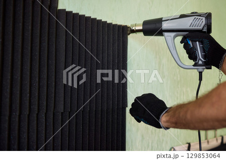 Applying Soundproof Foam Panels Securely Using a Hot Glue Gun for Better Performance and Insulation 129853064