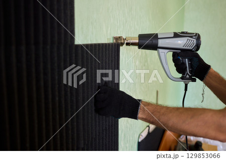 Applying Soundproof Foam Panels Securely Using a Hot Glue Gun for Better Performance and Insulation 129853066