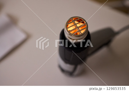 This versatile heat gun is ideal for various DIY projects, home repairs, and renovations 129853535