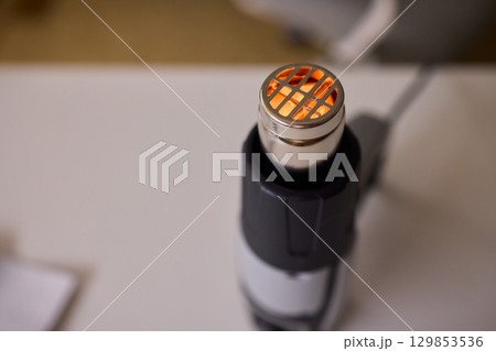 This versatile heat gun is ideal for various DIY projects, home repairs, and renovations 129853536