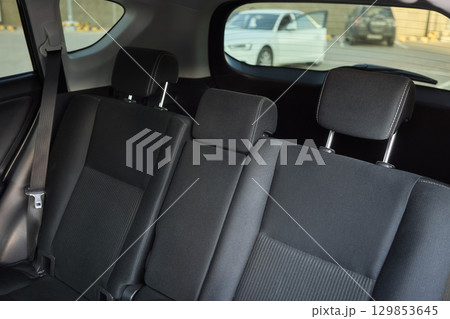 Car back seat with headrest and arm rest, a comfortable automotive fixture 129853645
