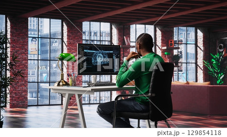 African american technician writes code on AI brain neural network for machine learning, doing maintenance and debugging the software systems. IT expert uses programming language. Camera A. African american technician writes code on AI brain neural network for machine learning, doing maintenance and debugging the software systems. IT expert uses programming language. Camera A. 129854118