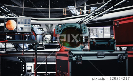 Malfunction indicator blinking in starship over astronaut helmet next to laptop showing performance metrics during cosmic flight. Danger alert flashing over cosmonaut gear in spaceship 129854217