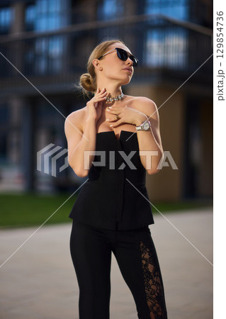 An Elegant Fashion Portrait Featuring a Beautiful Woman in a Stylish and Trendy Outfit An Elegant Fashion Portrait Featuring a Beautiful Woman in a Stylish and Trendy Outfit 129854736