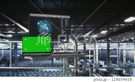 Server hub isolated screen laptop monitoring systems processing deep learning datasets for AI workflows. Mockup notebook tracking equipment supporting artificial intelligence model development Server hub isolated screen laptop monitoring systems processing deep learning datasets for AI workflows. Mockup notebook tracking equipment supporting artificial intelligence model development 129854919