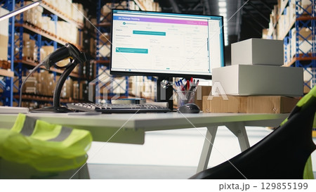 Empty warehouse setting used for shipping cargo products in boxes from online shopping local brand, ensuring fast delivery from the supply room. Fulfillment center operations. 129855199