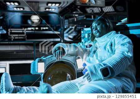 Astronaut lies still in cold spaceship chamber after temperature control failure causes severe heat loss. Crew member freezing in space station after conditions drop below survival limit Astronaut lies still in cold spaceship chamber after temperature control failure causes severe heat loss. Crew member freezing in space station after conditions drop below survival limit 129855451