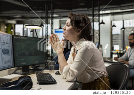 Financial consultant celebrating live forex trends improvement, progress and achievement in increasing the capital funds of the multinational company. Economic growth opportunity. 129856120