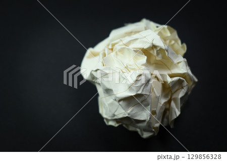 round lump paper on black background, recycle used paper round lump paper on black background, recycle used paper 129856328