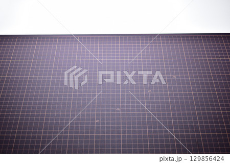 black cutting mat board on white background with line and scale measure guide pattern for art design black cutting mat board on white background with line and scale measure guide pattern for art design 129856424