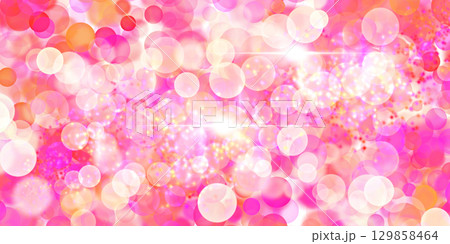 Festive background with glowing bokeh lights in pink,orange and white tones. Sparkly design. Festive background with glowing bokeh lights in pink,orange and white tones. Sparkly design. 129858464