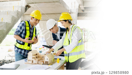 Engineer teams meeting working together wear worker helmets hardhat on construction site Engineer teams meeting working together wear worker helmets hardhat on construction site 129858980