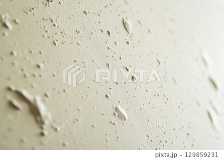 Beige textured wall with stucco background, and home decor. 129859231