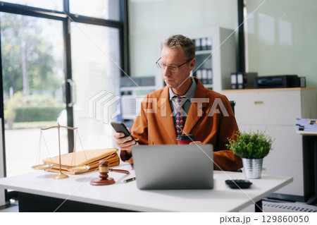 Caucasian male judge in courtroom, lawyer working in office. Perfect for business, legal advice, corporate 129860050