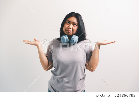 Asian girl expresses dislike, person express negative feeling, concept business complaint from customer ensuring employee satisfaction negative feedback to prevent mental strain customer dislike Asian girl expresses dislike, person express negative feeling, concept business complaint from customer ensuring employee satisfaction negative feedback to prevent mental strain customer dislike 129860795