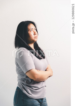 Asian girl expresses dislike, person express negative feeling, concept business complaint from customer ensuring employee satisfaction negative feedback to prevent mental strain customer dislike 129860821