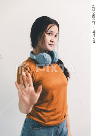 Asian girl expresses dislike, person express negative feeling, concept business complaint from customer ensuring employee satisfaction negative feedback to prevent mental strain customer dislike Asian girl expresses dislike, person express negative feeling, concept business complaint from customer ensuring employee satisfaction negative feedback to prevent mental strain customer dislike 129860837