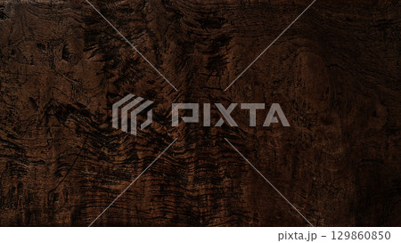 複雑で粗い木目の模様が残る横長の暗い茶褐色の板の背景画像 複雑で粗い木目の模様が残る横長の暗い茶褐色の板の背景画像 129860850