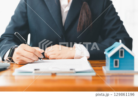 Real estate agent delivering sample home to customer, mortgage loan contract. Contract for hire purchase sale of house. home insurance contract, home mortgage loan concept. real estate, customer Real estate agent delivering sample home to customer, mortgage loan contract. Contract for hire purchase sale of house. home insurance contract, home mortgage loan concept. real estate, customer 129861196