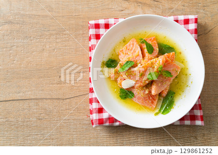 fresh salmon raw spicy seafood salad 129861252