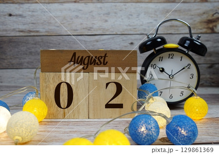 Wooden Calendar Showing the Date of August 2nd. Day 2 of August month 129861369