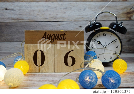 Wooden Calendar Showing the Date of August 6th. Day 6 of August month 129861373