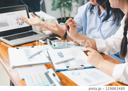 Teamwork with business people analysis cost graph on desk at meeting room. partnership analysis graph company financial budget report, cost work progress planning, business team analysis graph data Teamwork with business people analysis cost graph on desk at meeting room. partnership analysis graph company financial budget report, cost work progress planning, business team analysis graph data 129861480