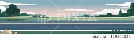 Horizontal or landscape four lane asphalt road. On the wide grassland with grass and trees growing on the side of the road. Soft colors of the mountains and a calm evening sky. 129861820