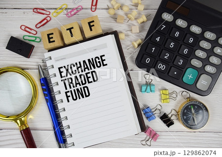 ETF Exchange Traded Fund acronym on notepad, business and financial concept background 129862074