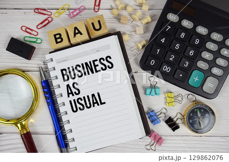 BAU Business as Usual acronym on notepad, business and financial concept background BAU Business as Usual acronym on notepad, business and financial concept background 129862076