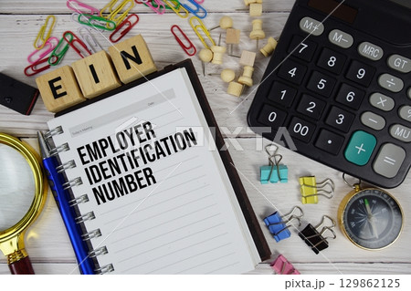 EIN Employer Identification Number acronym on notepad, Business and Financial concept background 129862125
